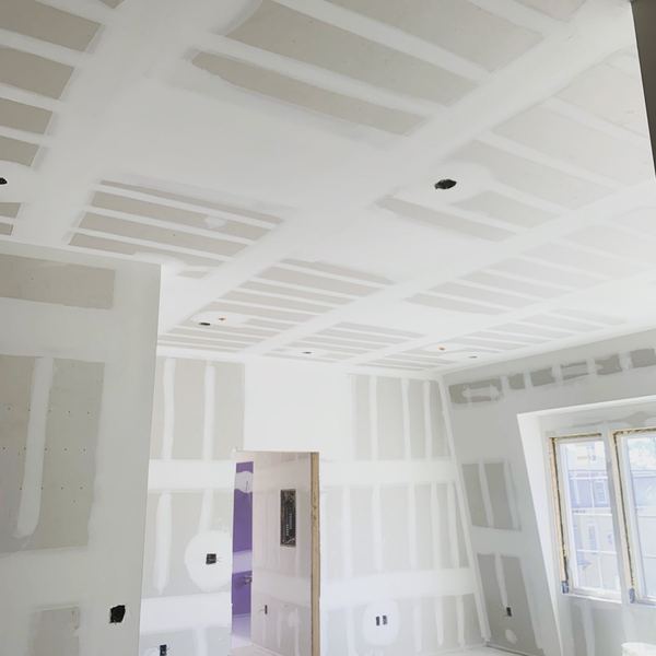 Taped ceilings in a multifamily unit