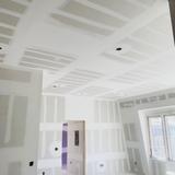 Taped ceilings in a multifamily unit