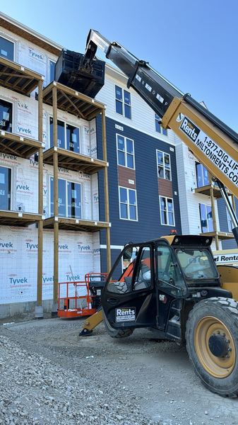 Board loaded by lift at a multifamily building