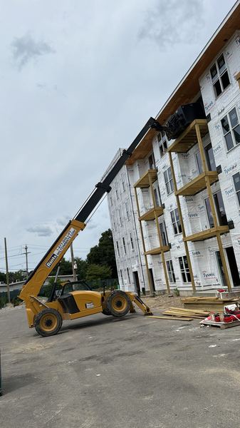 Telehandler stocking a multifamily building