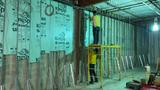 Crew on scaffolding at light gauge metal frame walls with foam board